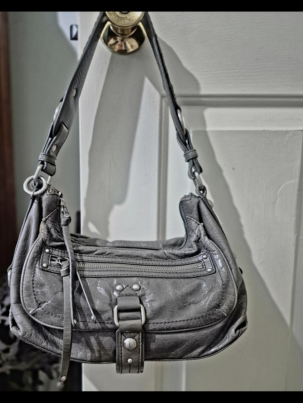 The Sak Gray Leather Small Shoulder Satchel with Front Buckle and Zip Pocket